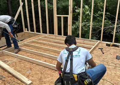 Bystone contractors framing a home addition wall structure on-site in Birmingham, A
