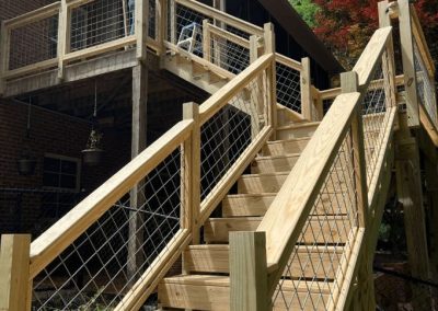 Custom outdoor wooden deck staircase installation by Bystone in Birmingham, AL
