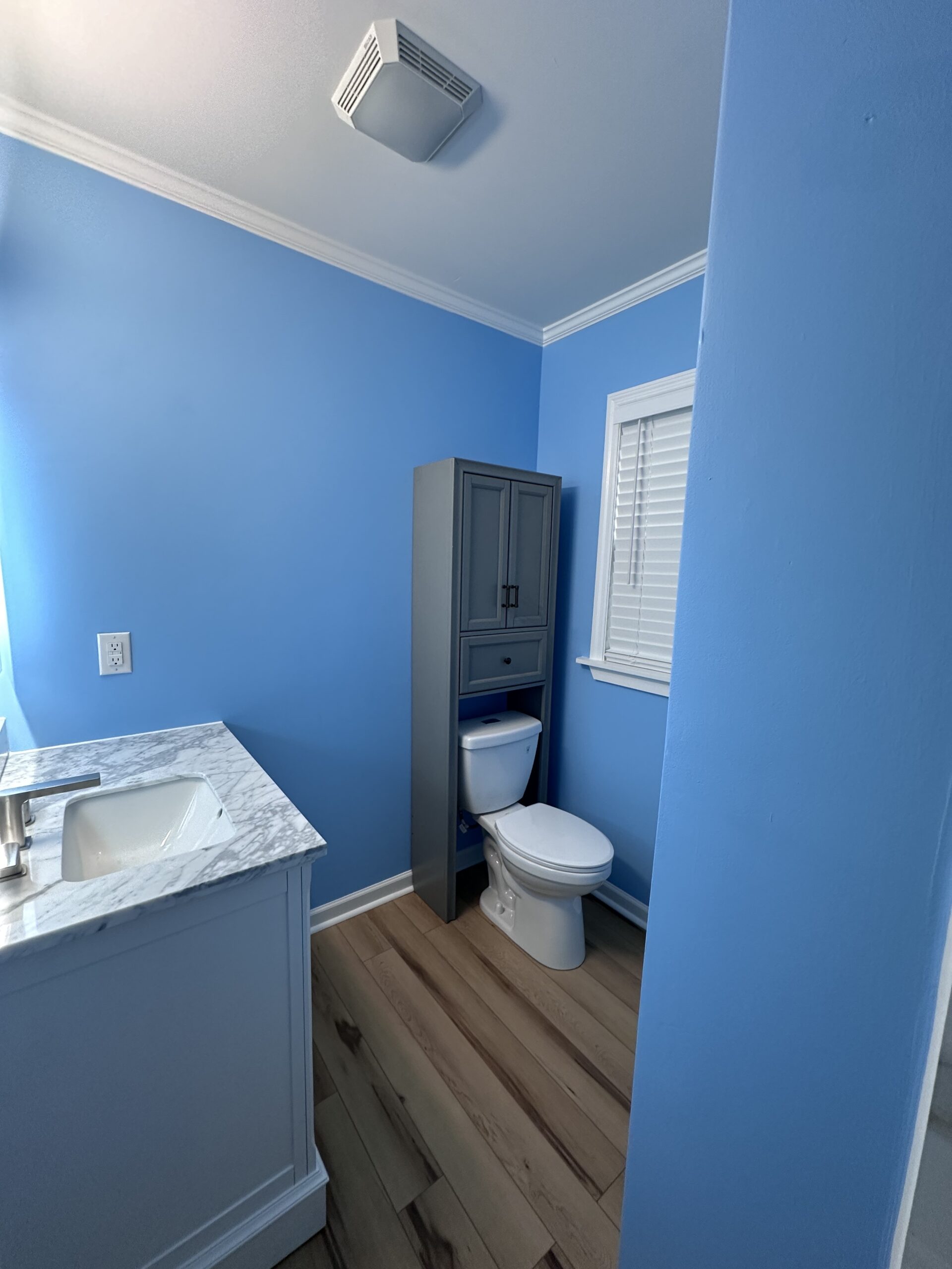 beautiful bright updated bathroom with LED mirror by Bystone