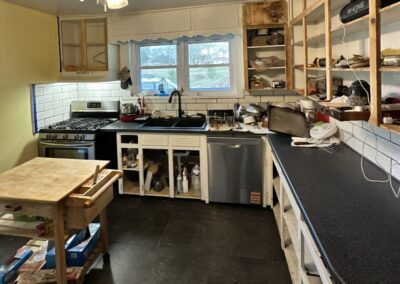 Before photo of unfinished kitchen tile flooring and remodel left incomplete by a previous contractor in Hoover AL.