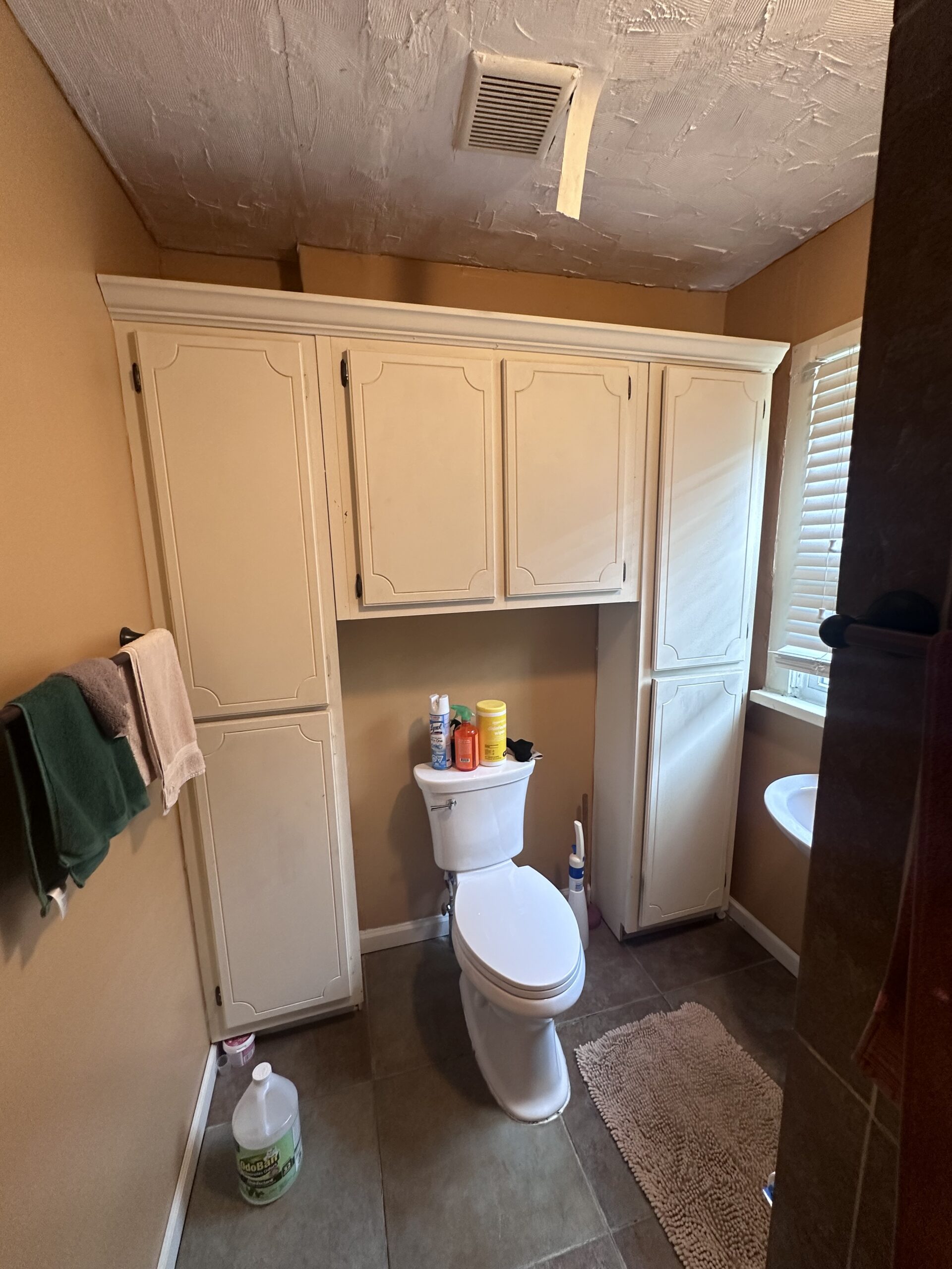 small-bathroom-renovation-before-photo Before: A cramped, outdated bathroom lacking style and functional space. See how we transformed this layout below.