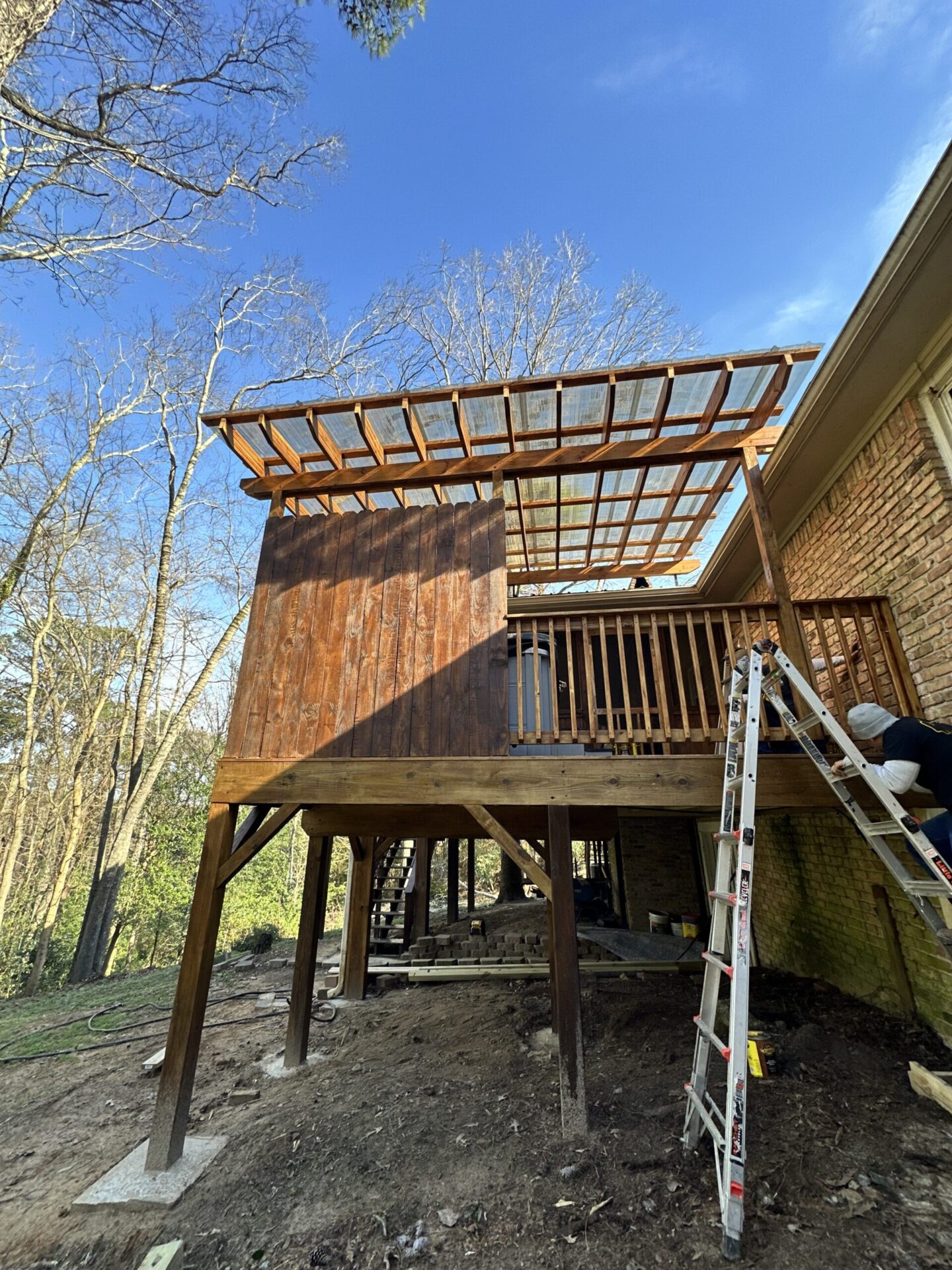 Custom heavy-duty residential deck framing and structural post installation under construction